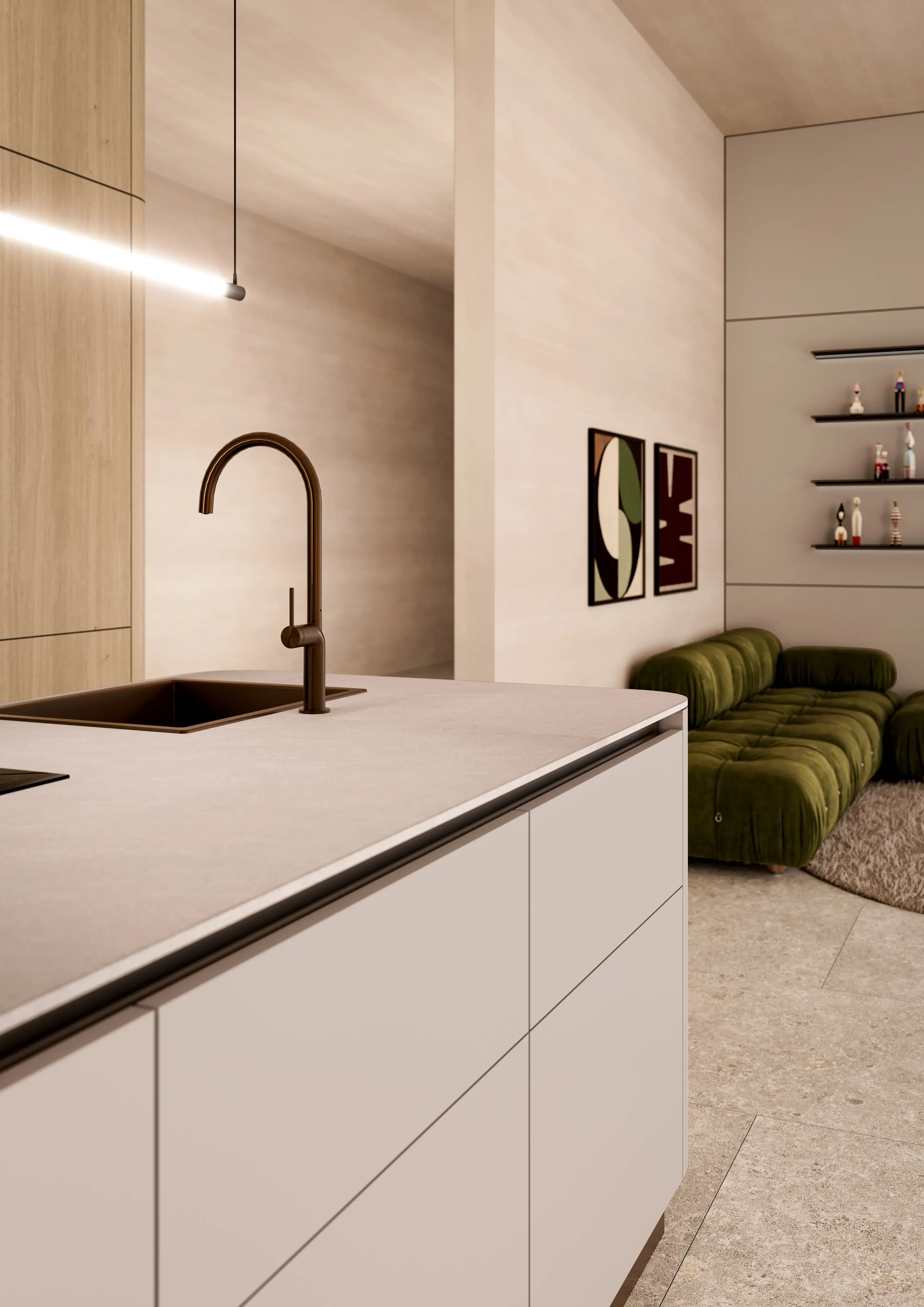 Moderne Küche mit Insel, braunem Wasserhahn, grünem Sofa im Hintergrund.